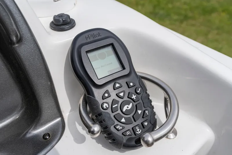 Slide: The Image of Remote control on a 2022 Hurricane SS201 boat console, featuring iPilot technology. - 18