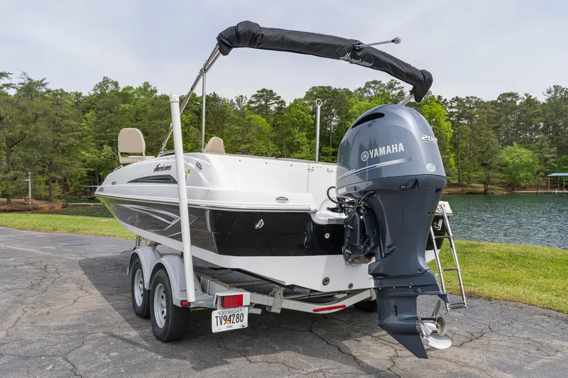 Slide: The Image of 2022 Hurricane SS201 boat with Yamaha engine on a trailer by a lake. - 4