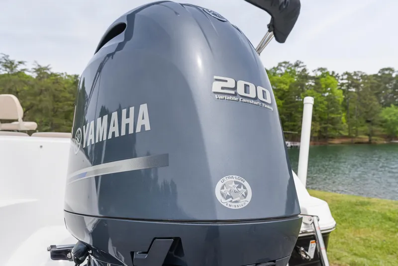 Slide: The Image of Yamaha 200 outboard motor on 2022 Hurricane SS201 boat by a lake. - 6