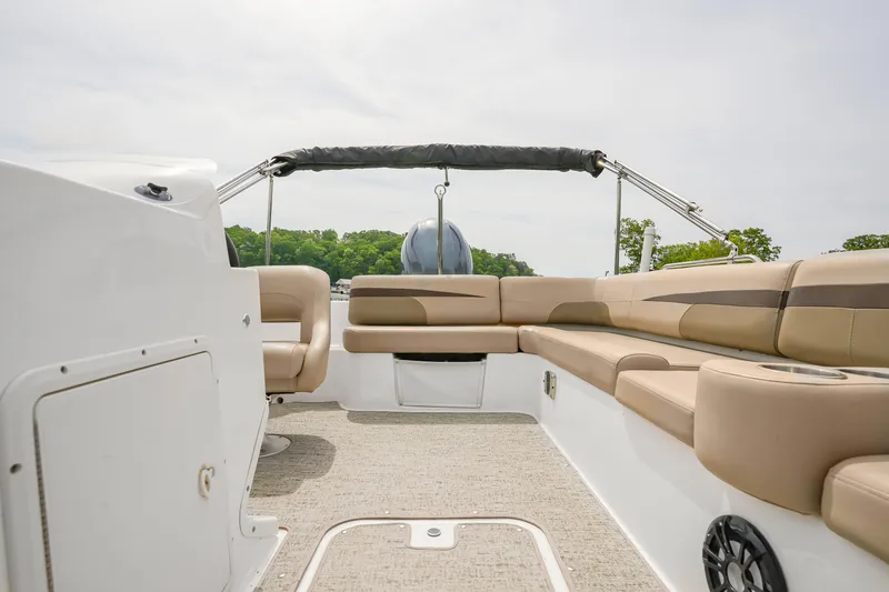Slide: The Image of 2022 Hurricane SS201 boat interior with beige seating and open deck. - 9
