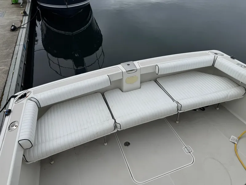 Slide: The Image of 2008 Back Cove 29 Hardback interior with blue seating and wooden table. - 20