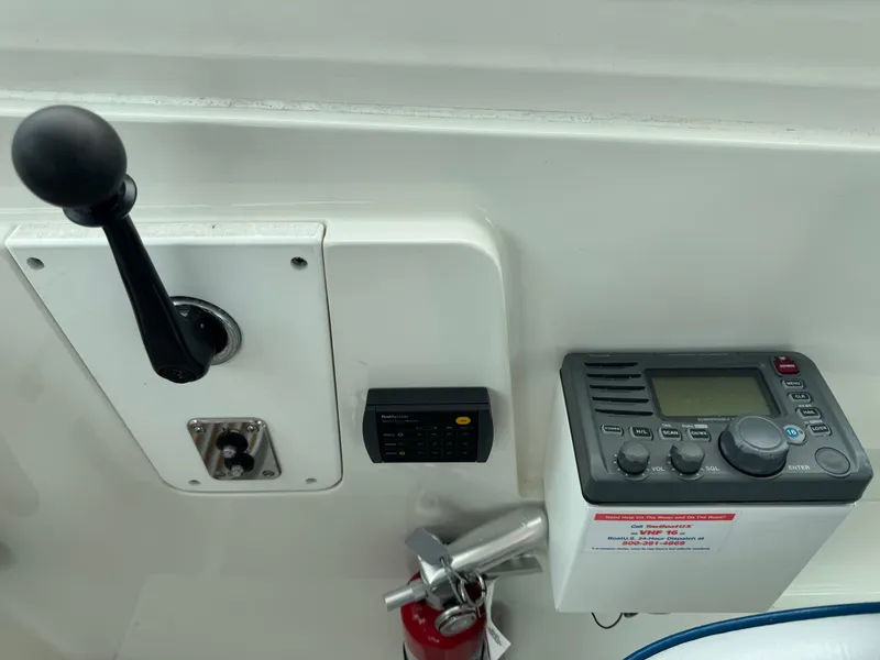 Slide: The Image of 2008 Back Cove 29 Hardback boat bathroom with sink, toilet, and storage cabinets. - 23