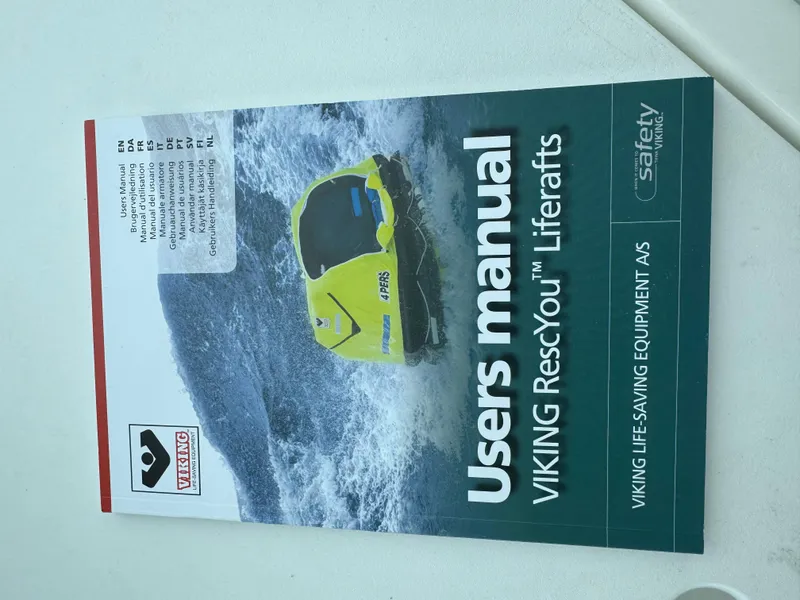 Slide: The Image of Safety instructions on a 2008 Back Cove 29 Hardback boat, featuring a Viking RescYou liferaft. - 33