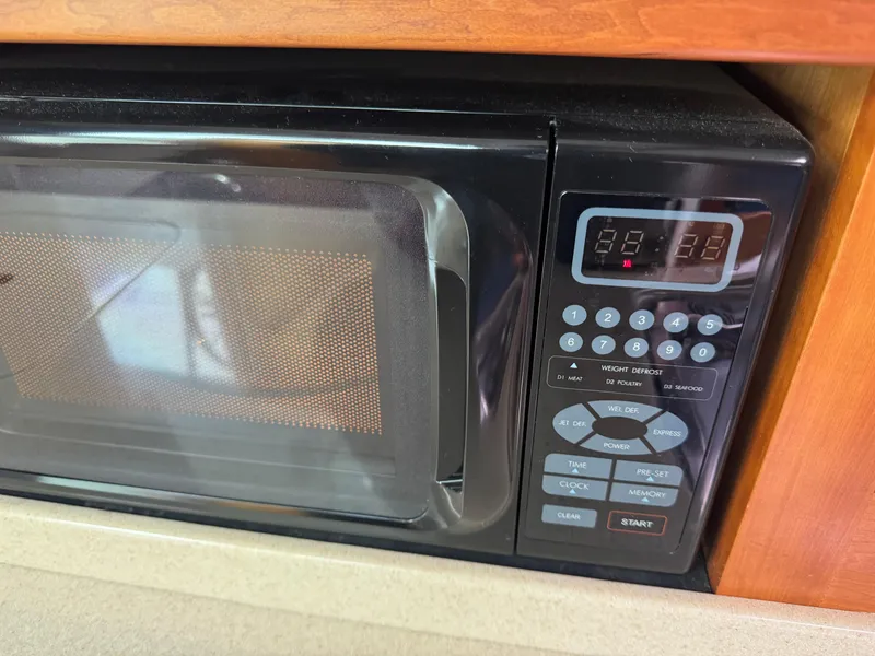 Slide: The Image of Raymarine C120 navigation system on 2008 Back Cove 29 Hardback boat dashboard. - 38