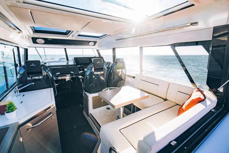 Slide: The Image of Interior of 2025 Wellcraft 38 Explorer yacht with modern seating and ocean view. - 6
