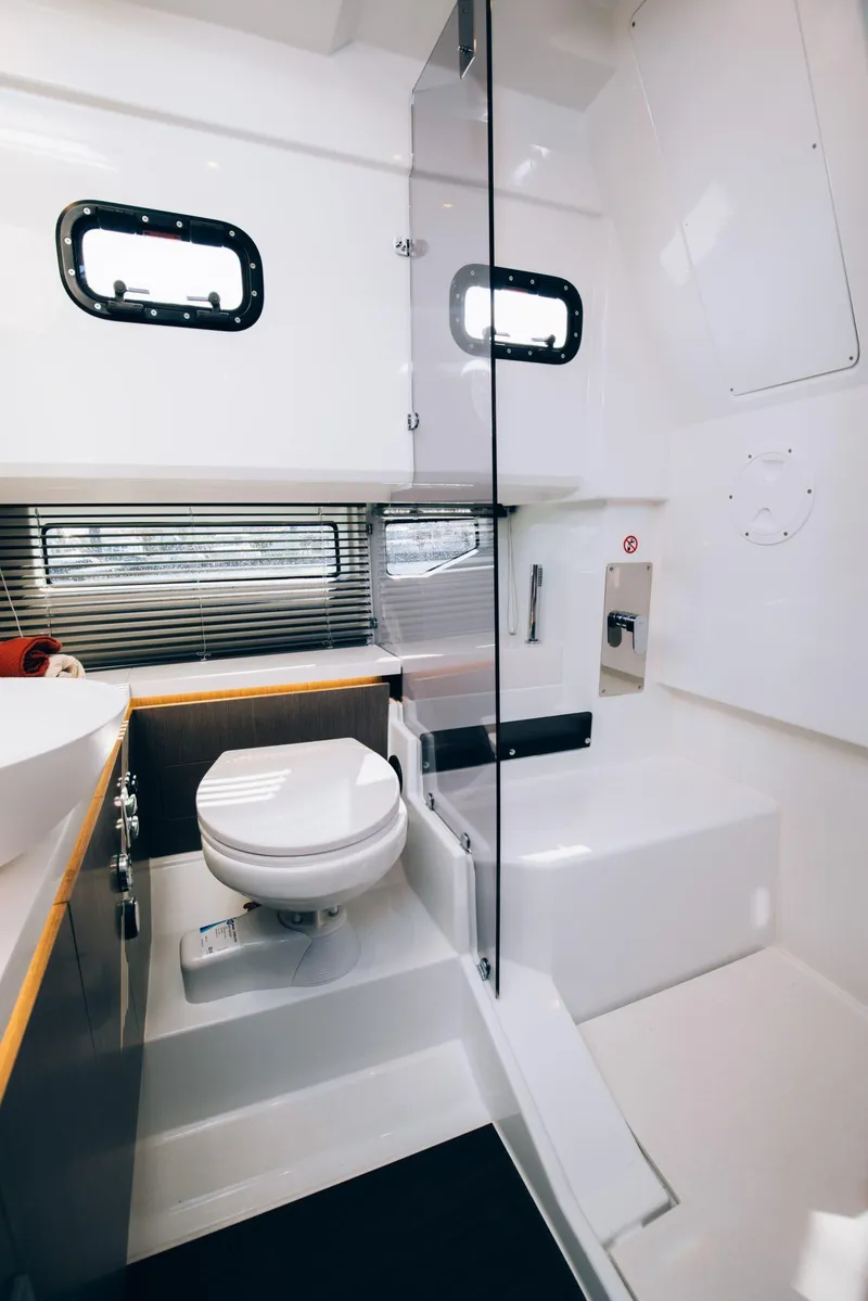 Slide: The Image of Modern bathroom in 2025 Wellcraft 38 Explorer yacht with sleek design and compact layout. - 11