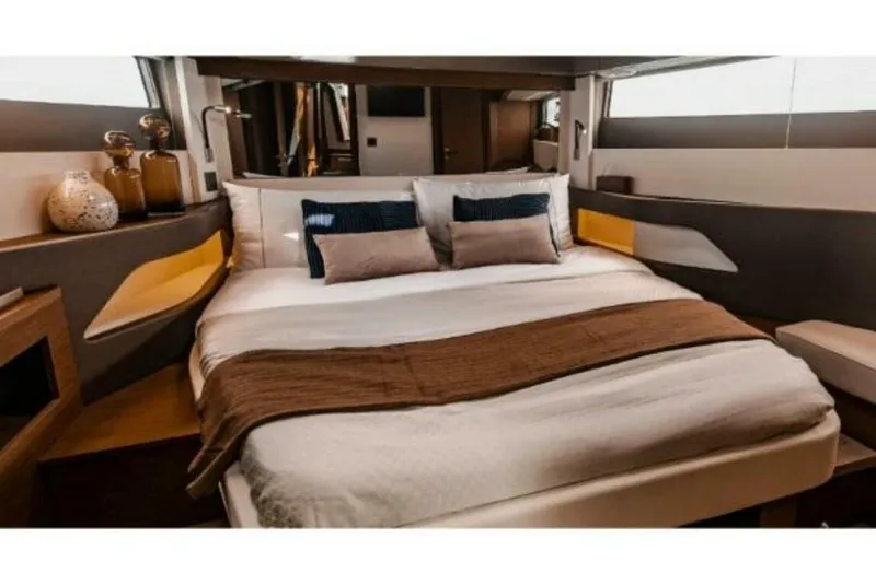 Slide: The Image of Luxurious bedroom interior of 2025 Wellcraft 44 Explorer yacht, featuring modern design and cozy bedding. - 12