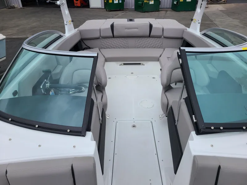 Slide: The Image of 2023 Four Winns H4 boat interior with sleek seating and modern design. - 17