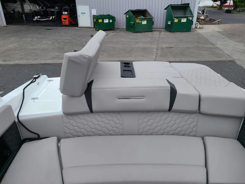 Slide: The Image of 2023 Four Winns H4 boat interior with gray seating and adjustable backrest. - 20
