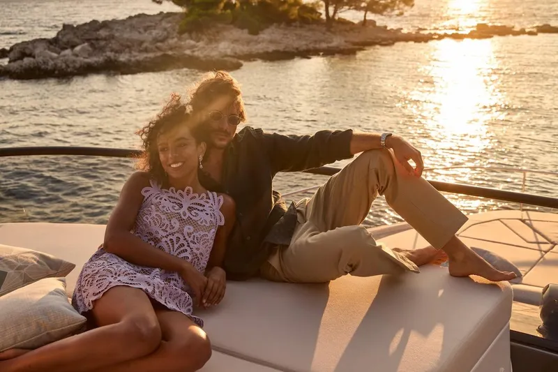 Slide: The Image of Couple relaxing on a Prestige M7 yacht at sunset, 2025 model. - 112