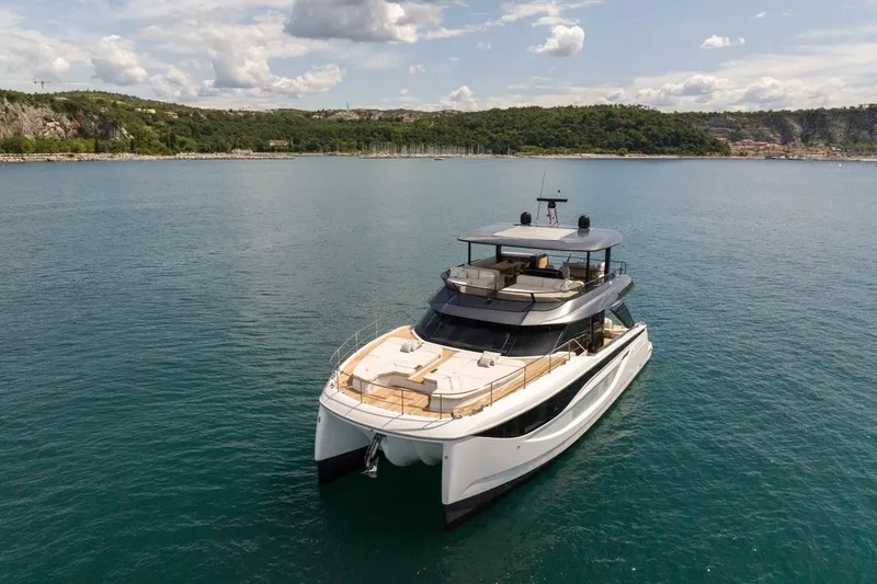 Slide: The Image of Luxury Prestige M7 yacht cruising on serene waters, 2025 model. - 26