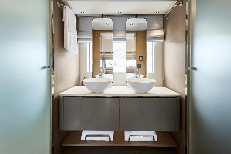Slide: The Image of Modern bathroom interior in 2025 Prestige M7 yacht, featuring dual sinks and sleek design. - 34