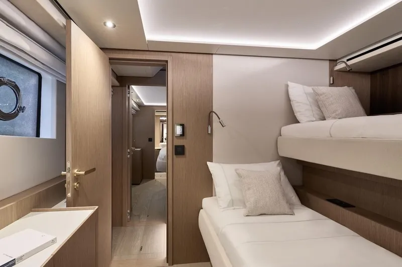 Slide: The Image of Luxurious interior of 2025 Prestige M7 yacht with modern bunk beds and elegant wood finish. - 42
