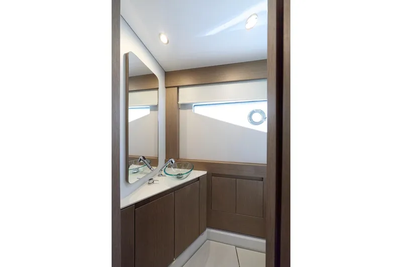 Slide: The Image of Modern bathroom interior in 2025 Prestige M7 yacht, featuring sleek design and glass sink. - 44