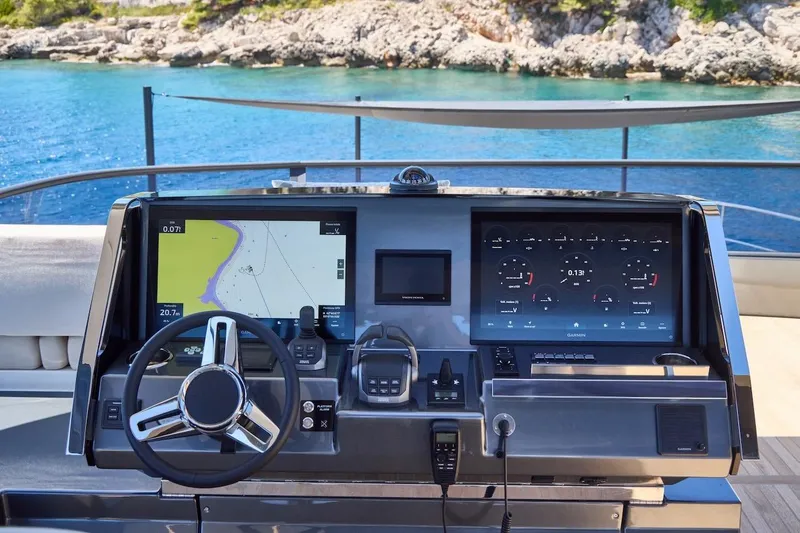 Slide: The Image of Modern helm of 2025 Prestige M7 yacht with navigation screens and steering wheel. - 50