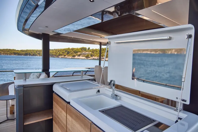 Slide: The Image of Luxurious Prestige M7 yacht kitchen area with ocean view, 2025 model. - 52