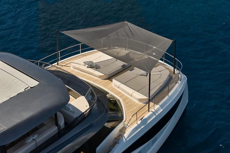Slide: The Image of Luxurious 2025 Prestige M7 yacht with sun deck and canopy on blue ocean. - 57