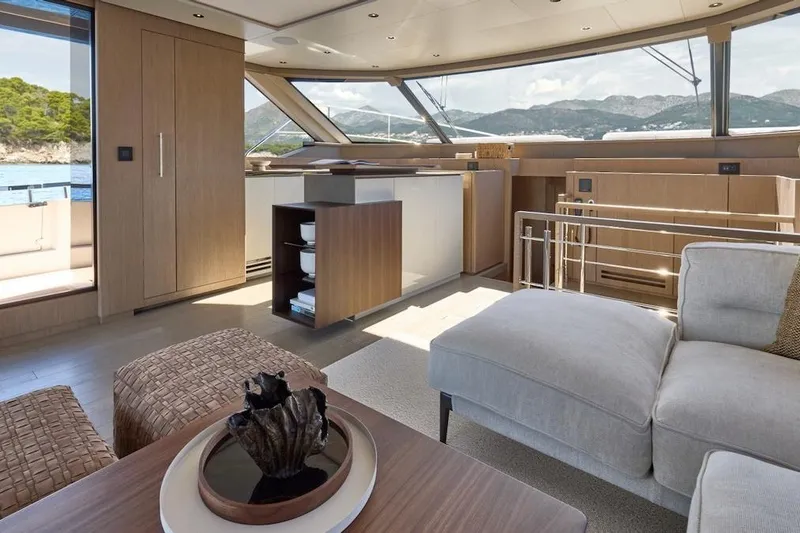 Slide: The Image of Luxurious interior of 2025 Prestige M7 yacht with modern furnishings and panoramic windows. - 62