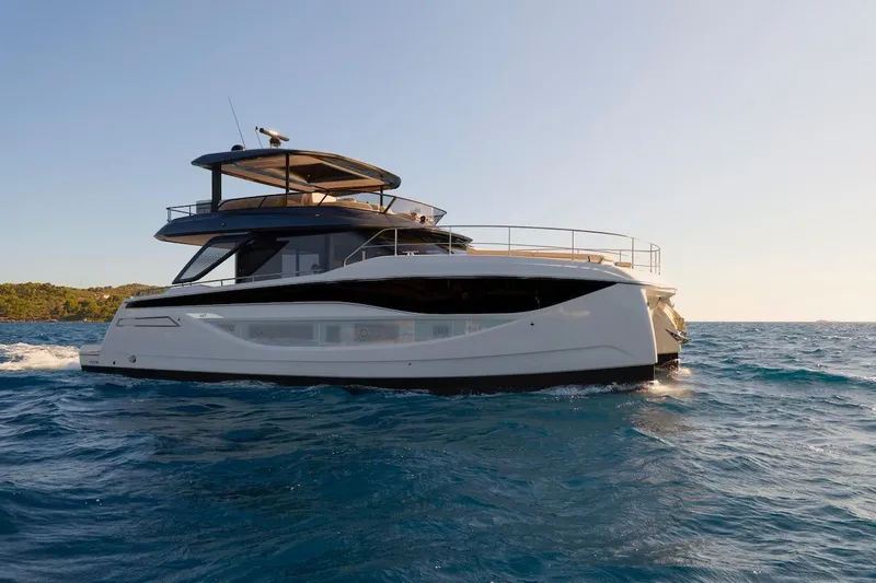 Slide: The Image of Luxury Prestige M7 yacht cruising on open sea, 2025 model. - 64