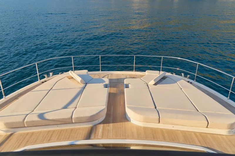Slide: The Image of Luxury sun deck on 2025 Prestige M7 yacht overlooking serene ocean waters. - 66