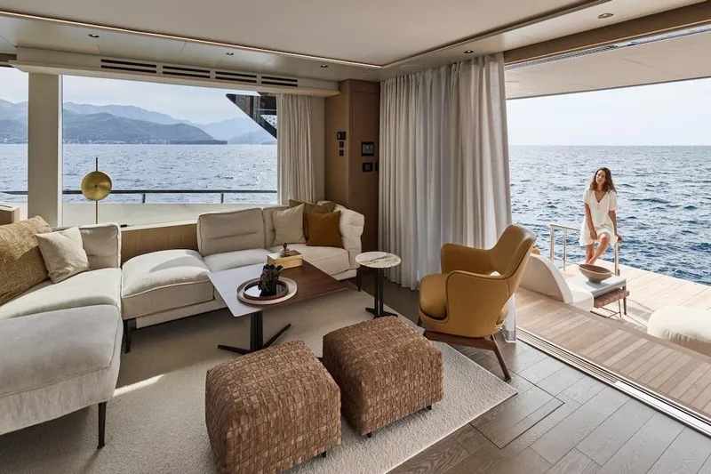 Slide: The Image of Luxurious Prestige M7 yacht interior with ocean view, featuring elegant seating and modern decor, 2025 model. - 77