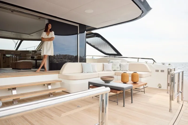 Slide: The Image of Luxury Prestige M7 yacht deck with elegant seating and ocean view, 2025 model. - 79