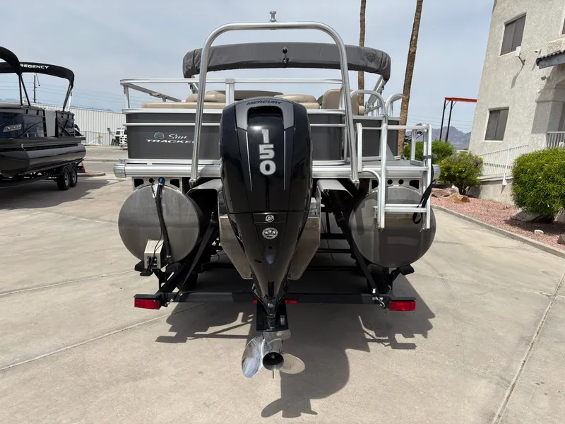 Slide: The Image of 2017 Sun Tracker Fishin' Barge 22 DLX pontoon boat with 150 HP engine, rear view. - 5