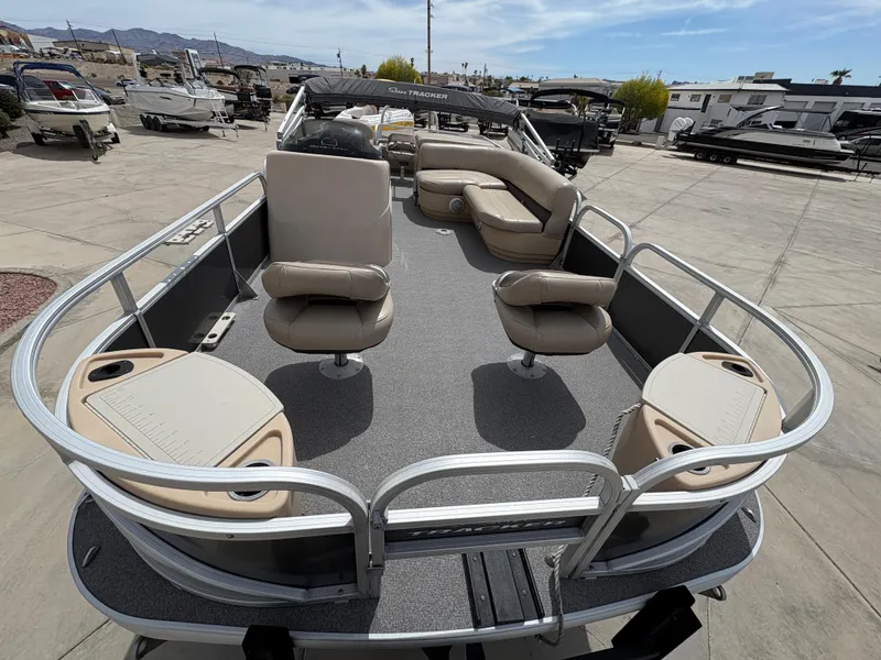 Slide: The Image of 2017 Sun Tracker Fishin' Barge 22 DLX pontoon boat with spacious seating and fishing amenities. - 7