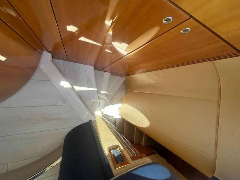 Slide: The Image of Interior staircase of 2006 Azimut 55E yacht with wooden finish and elegant design. - 11