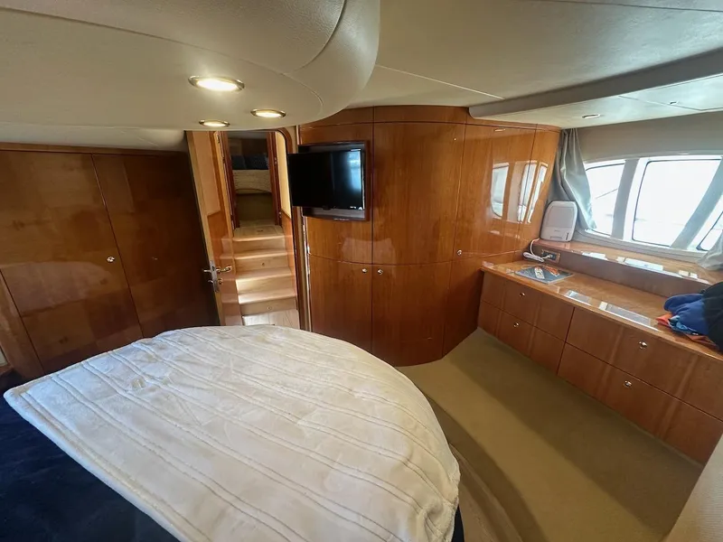 Slide: The Image of Luxurious interior of 2006 Azimut 55E yacht with wood paneling and modern amenities. - 13