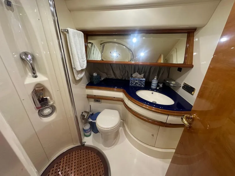 Slide: The Image of Luxurious bathroom in a 2006 Azimut 55E yacht with elegant fixtures and modern design. - 19