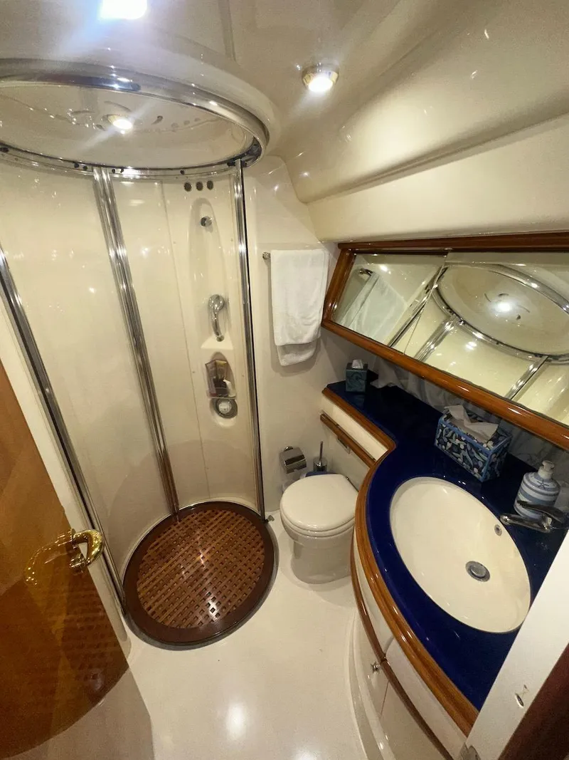 Slide: The Image of Luxurious bathroom in 2006 Azimut 55E yacht with shower, sink, and mirror. - 21