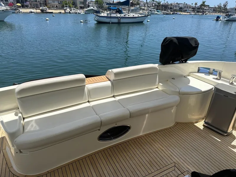 Slide: The Image of Luxury seating on 2006 Azimut 55E yacht with scenic marina view. - 26