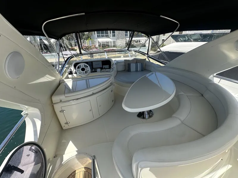 Slide: The Image of Luxurious 2006 Azimut 55E yacht interior with elegant seating and modern helm. - 27