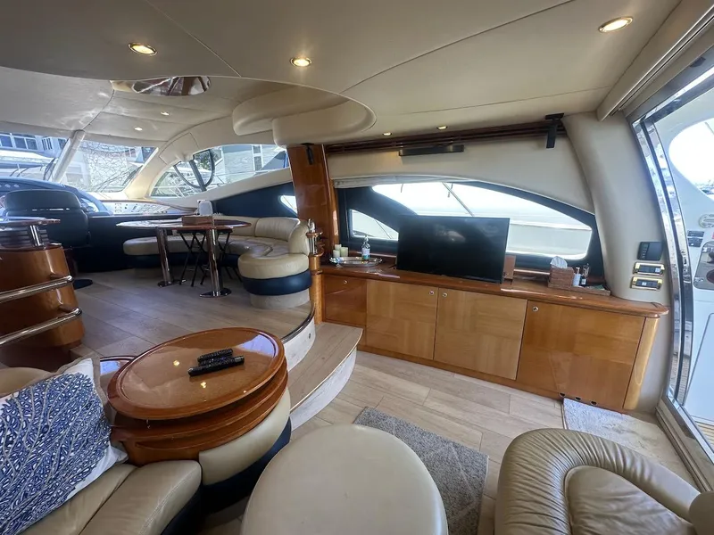 Slide: The Image of Luxurious interior of a 2006 Azimut 55E yacht with elegant seating and modern amenities. - 3