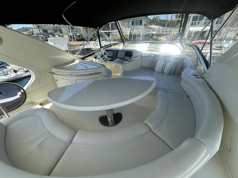Slide: The Image of Luxurious interior of 2006 Azimut 55E yacht with elegant seating and table. - 31