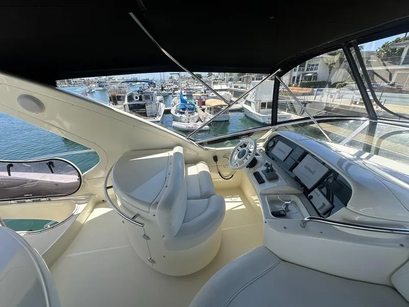 Slide: The Image of Interior view of 2006 Azimut 55E yacht cockpit with steering wheel and navigation screens. - 33