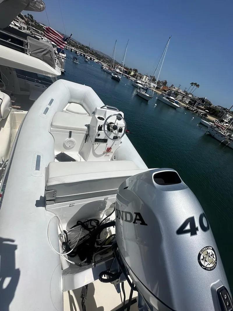 Slide: The Image of Inflatable boat with Honda 40 engine on Azimut 55E yacht, 2006 model, docked in marina. - 35