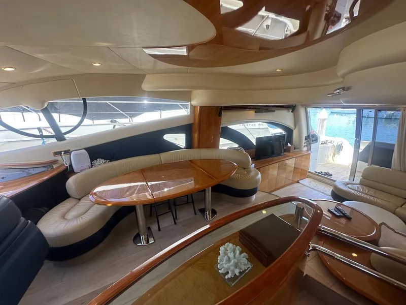 Slide: The Image of Luxurious interior of a 2006 Azimut 55E yacht with elegant seating and wooden finishes. - 5
