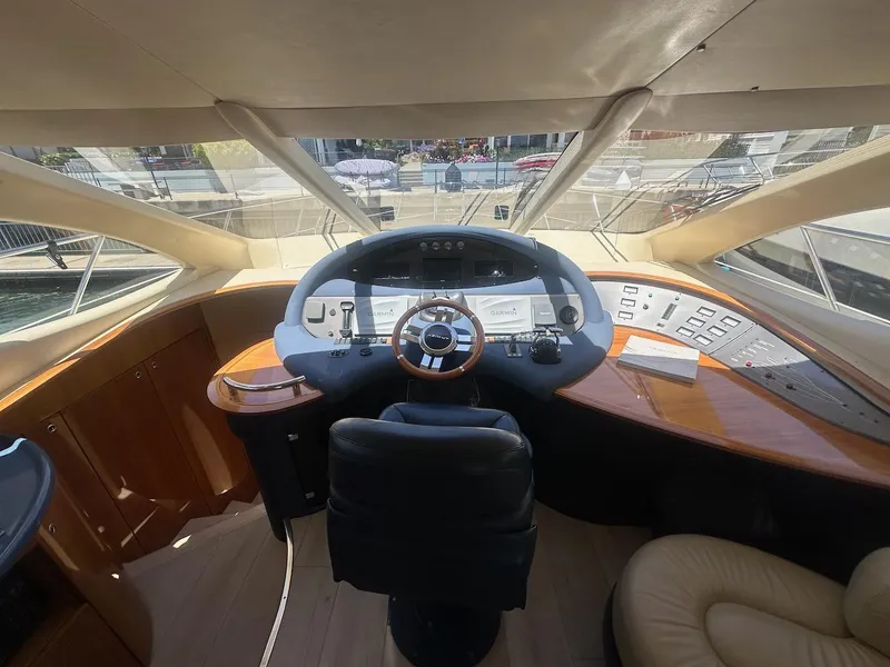 Slide: The Image of Interior helm of 2006 Azimut 55E yacht with modern controls and leather seating. - 6