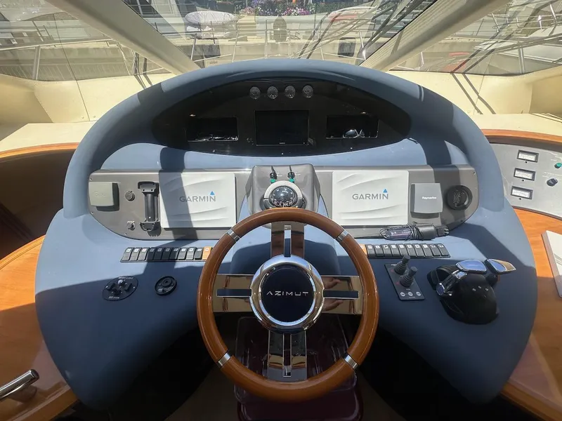 Slide: The Image of Helm of 2006 Azimut 55E yacht with Garmin navigation system and wooden steering wheel. - 7