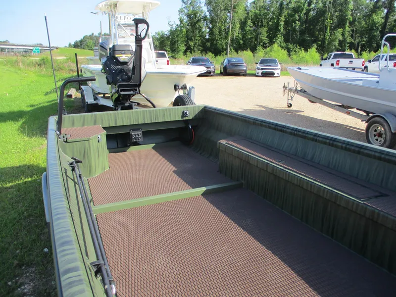 Slide: The Image of 2025 Gator Tail 2054 Extreme boat on trailer, parked outdoors with other vehicles. - 5