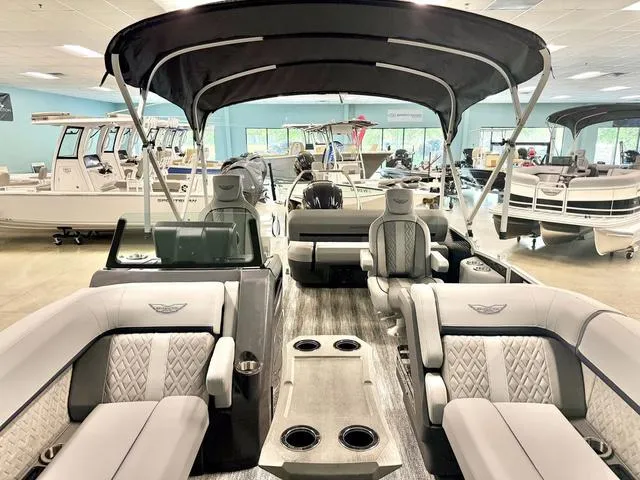 Slide: The Image of 2025 Bennington M Swingback 22 MSB pontoon boat interior with luxurious seating and canopy. - 3