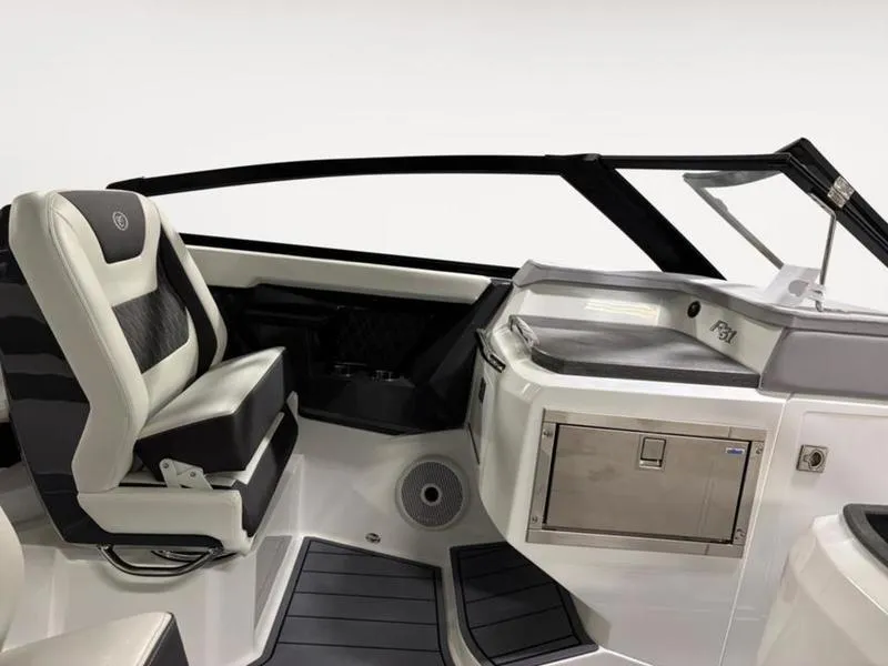 Slide: The Image of 2025 Cobalt R31 boat interior with sleek seating and modern dashboard design. - 13