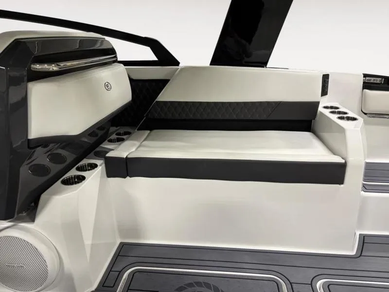 Slide: The Image of 2025 Cobalt R31 boat interior with sleek seating, cup holders, and modern design elements. - 17