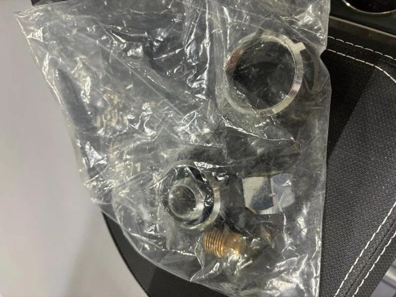 Slide: The Image of Plastic-wrapped metal components for Cobalt R31, 2025 model, on a black surface. - 20