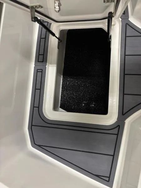 Slide: The Image of 2025 Cobalt R31 boat storage compartment with sleek design and modern finish. - 26