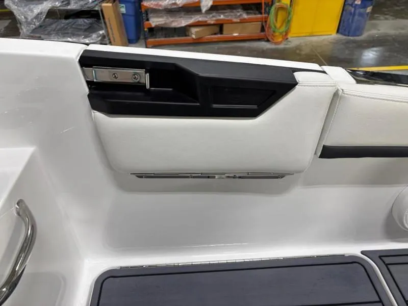 Slide: The Image of Interior detail of 2025 Cobalt R31 boat, featuring sleek white and black design elements. - 31