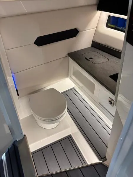 Slide: The Image of Modern bathroom interior in 2025 Cobalt R31 boat, featuring sleek design and compact layout. - 35