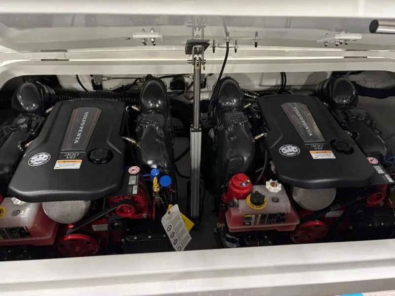 Slide: The Image of Twin engines in a 2025 Cobalt R31 boat, showcasing powerful marine performance. - 36